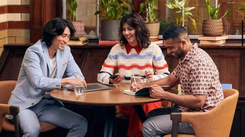 a group of three people sitting around a table at Kimpton Clocktower by IHG in Manchester