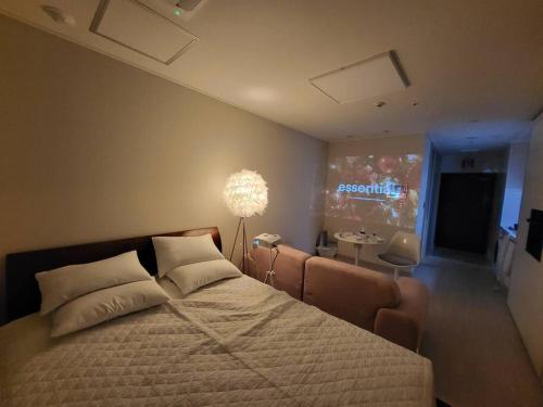 a bedroom with a large bed and a television at Geumjeong St1 Minute Seoul, Gangnam Transportation NICE in Gunpo