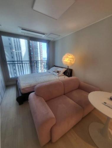 a living room with a couch and a bed at Geumjeong St1 Minute Seoul, Gangnam Transportation NICE in Gunpo