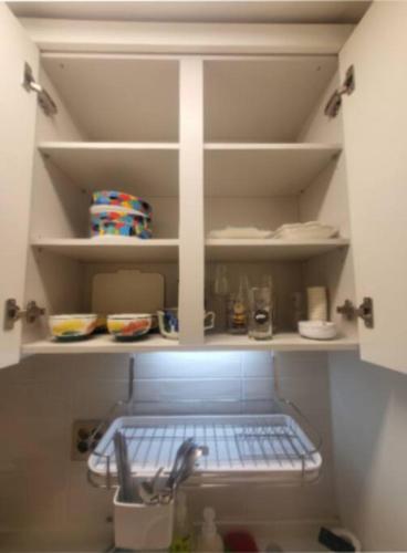a kitchen pantry with a sink and some dishes at Geumjeong St1 Minute Seoul, Gangnam Transportation NICE in Gunpo