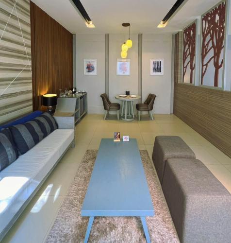 a living room with a couch and a table at Cae Villa Hua Hin in Hua Hin