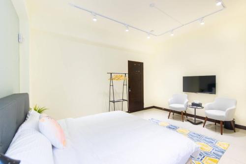 Cama o camas de una habitación en 禾畔の民宿-近冬山河童玩節-ktv烤肉包棟