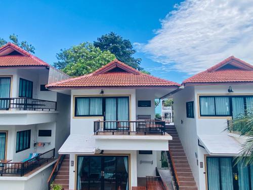 a row of houses with balconies on them at Simple Life Cliff View Resort in Koh Tao