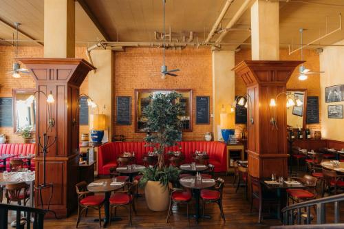 a restaurant with red chairs and tables in a room at Hotel Triton in San Francisco