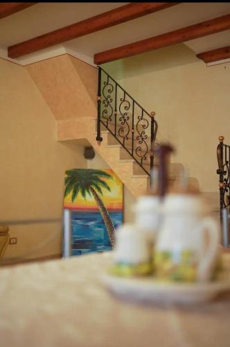 a stairway with a plate of food on a table at O Cannulicchiu in Altofonte