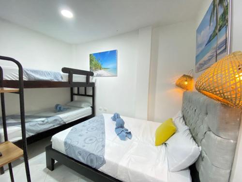 Postel nebo postele na pokoji v ubytování Hotel Hermoso Caribe