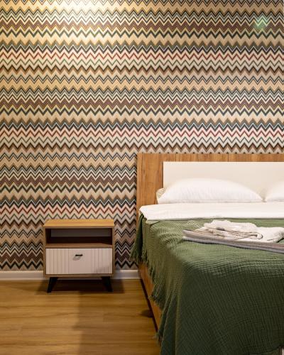 Un ou plusieurs lits dans un hébergement de l'établissement Guesthouse of Manoni Ratiani