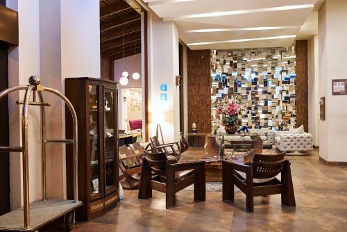 a store with chairs and a table in a room at Hotel Mitru Sur in La Paz