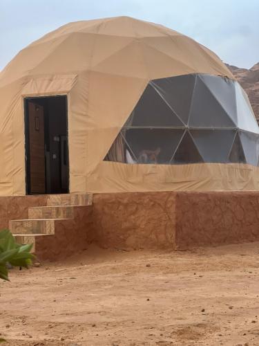 a dome tent in the middle of the desert at Radisson Wadi Rum Camp in Wadi Rum