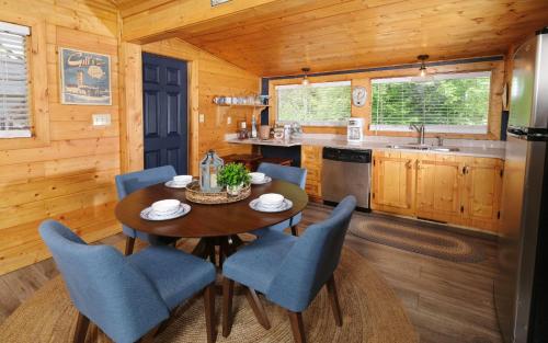 a dining room with a table and chairs in a cabin at Poolin Around in Gatlinburg