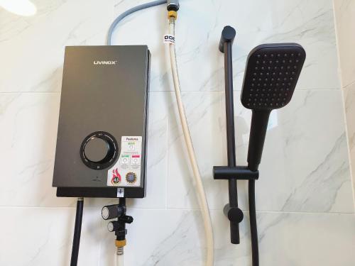 a speaker and a microphone on a wall at Bayu Temiang Luxury Design 7~8 Pax in Seremban