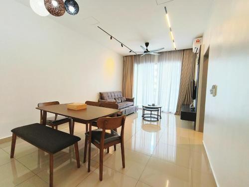 a living room with a dining room table and a couch at Bayu Temiang Luxury Design 7~8 Pax in Seremban