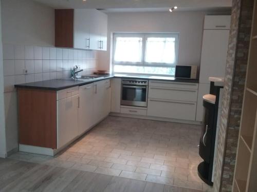 Kuchyň nebo kuchyňský kout v ubytování Ferienwohnung OT Meersburg