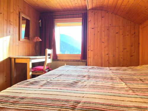 Postel nebo postele na pokoji v ubytování ZE Mountain Lodge, Morgins