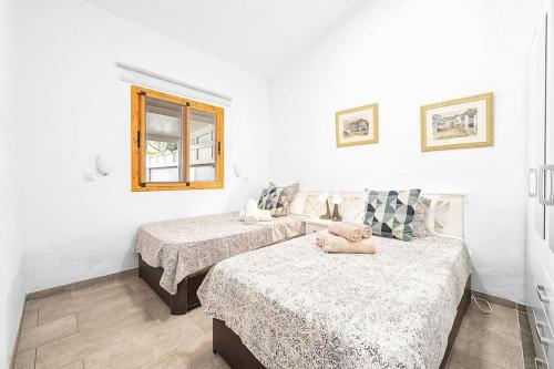 Ένα ή περισσότερα κρεβάτια σε δωμάτιο στο Bungalow en Maspalomas