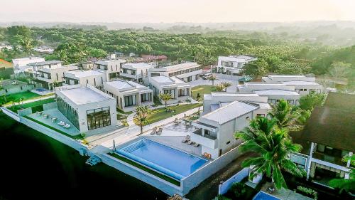 an aerial view of a house with a swimming pool at TANA Beach Villas in Lian