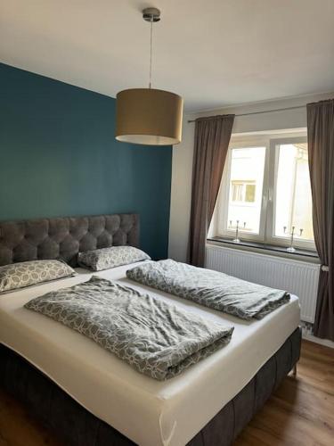 Postel nebo postele na pokoji v ubytování Modern eingerichtete 2 ZimmerWhg