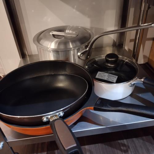 a frying pan and a pot on a counter at NorthHisath-Susukino in Sapporo