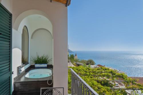 a balcony with a view of the ocean at Hotel Punta Regina in Positano