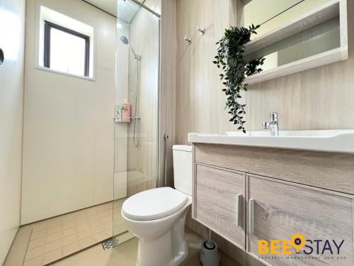 a bathroom with a toilet and a sink and a shower at Youth City Residence Family Suite KLIA AEON Mall Nilai USIM in Nilai