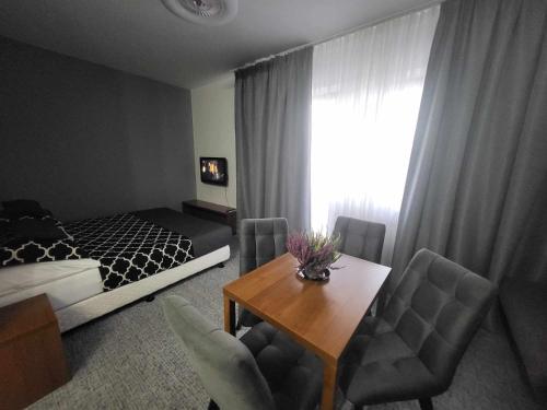 Ένα ή περισσότερα κρεβάτια σε δωμάτιο στο Apartmán Andrea Tatragolf