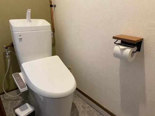a bathroom with a white toilet in a room at NorthHisath-Susukino in Sapporo