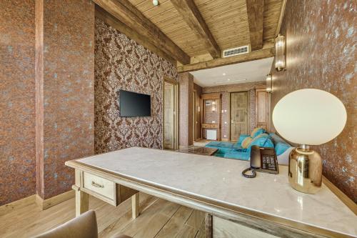 TV a/nebo společenská místnost v ubytování Ampelo Resort