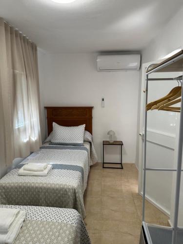 Postel nebo postele na pokoji v ubytování Casa Meme Nerja