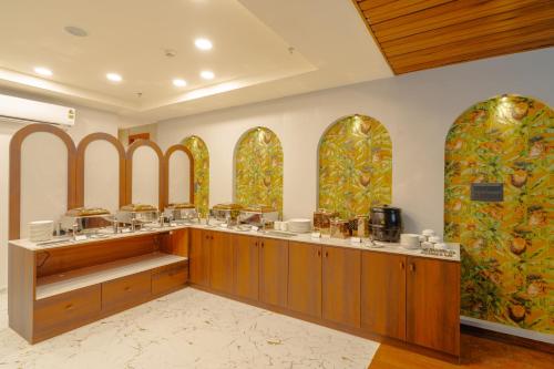 a room with a counter with aasteryasteryasteryasteryasteryasteryasteryasteryastery at Alokah Kashi in Varanasi
