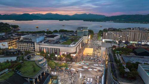 an aerial view of a city with a body of water at Hilton Garden Inn Hangzhou West Lake in Hangzhou