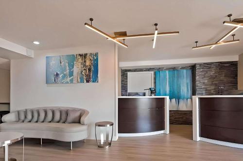 a living room with a couch and a table at Comfort Inn Hayward - Union City in Hayward