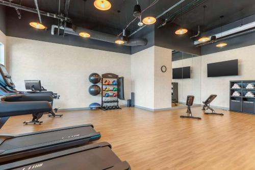 a gym with two treadmills and a treadmill at Cambria Hotel Denver Downtown RiNo in Denver