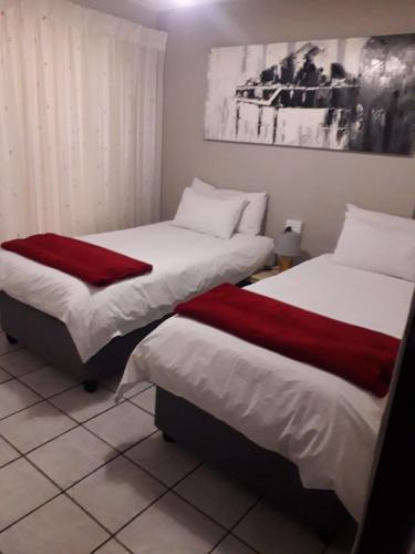 Ένα ή περισσότερα κρεβάτια σε δωμάτιο στο Protea Park Self Catering Guesthouse