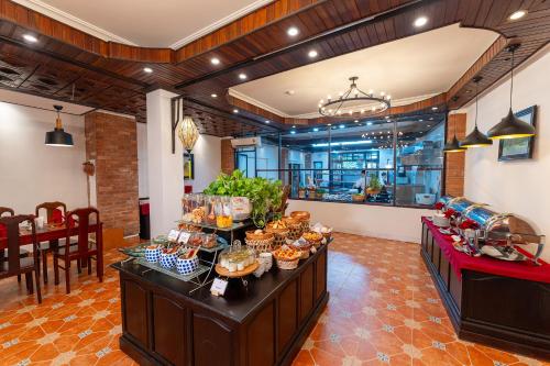 a buffet line with food on it in a restaurant at ANNAM HERITAGE - Thuy Duong 3 in Hoi An