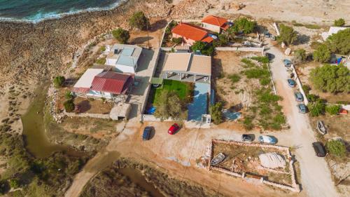 an aerial view of a house next to the ocean at Blue Lagoon Villa in Stavros