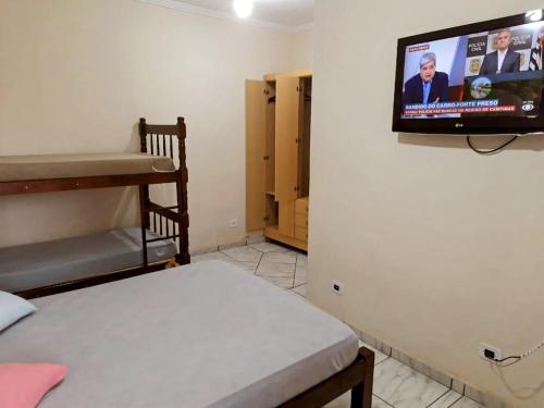 Et tv og/eller underholdning på Espaço Familiar