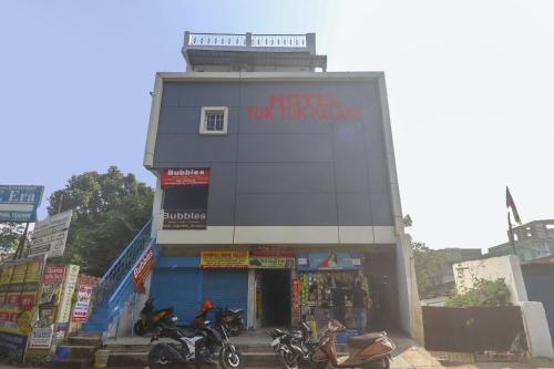 a building with motorcycles parked in front of it at Hotel O 67309 Hotel Tuk Tuk Palace in Rānchī