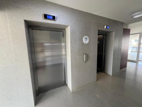 an elevator in a building with two elevators at Sea view in Boğaz