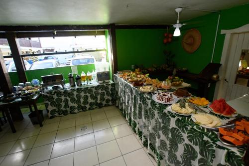 a table with many different types of food on it at Hotel Vale Verde in Porto Seguro