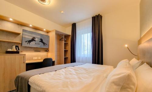 Katil atau katil-katil dalam bilik di Hotel Schwarzes Ross