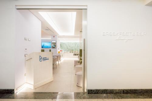 a conference room with a table and chairs at Hotel Gardenia Sorrento, Ascend Hotel Collection in Sorrento