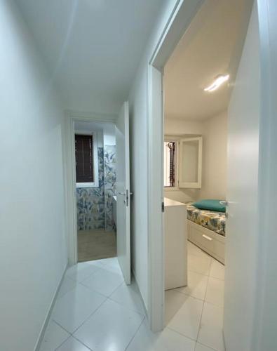 an open door to a bathroom in a house at Casa Plumeria in Marinella di Selinunte