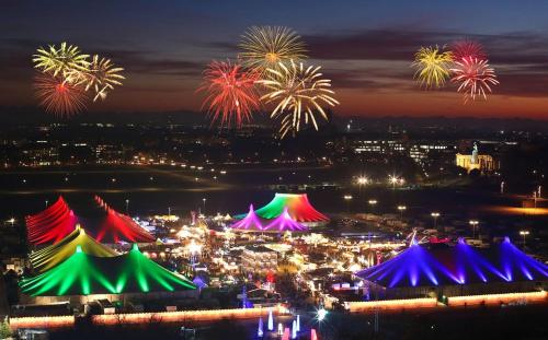 a group of colorful tents with fireworks in the background at Munich large Apartment 110 qm in very cetral location 1 to 12 Guests in Munich
