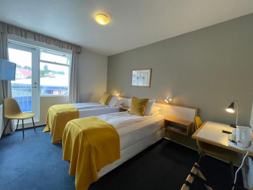 Posteľ alebo postele v izbe v ubytovaní Hotel Norðurland