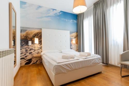 Postel nebo postele na pokoji v ubytování Hotel Regina