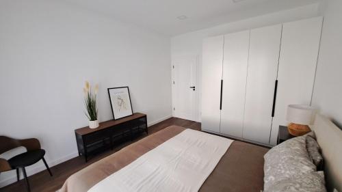 Ένα ή περισσότερα κρεβάτια σε δωμάτιο στο Jankaus apartamentai
