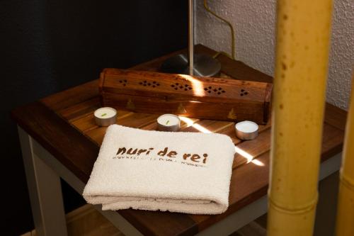 a table with a towel and candles on it at Casa Nuri de Rei La Pobla Tornesa in Puebla Tornesa