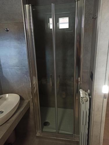 a shower with a glass door in a bathroom at Le Mirage in Chieti