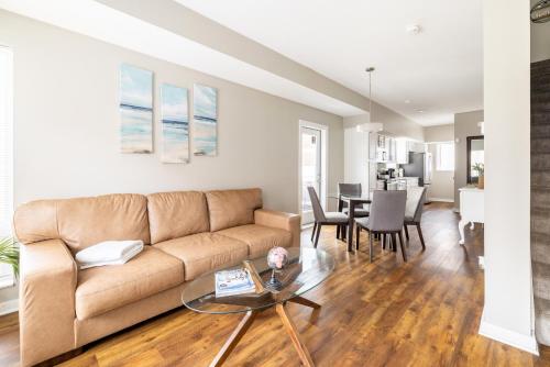 a living room with a couch and a table at Luxury Downtown Townhome Private Garage Unit 9 in Cleveland