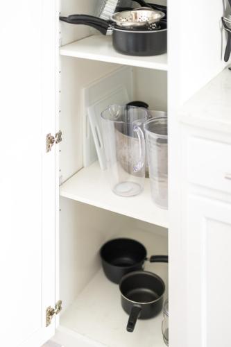 a kitchen pantry with white cabinets and utensils at Luxury Downtown Townhome Private Garage Unit 16 in Cleveland